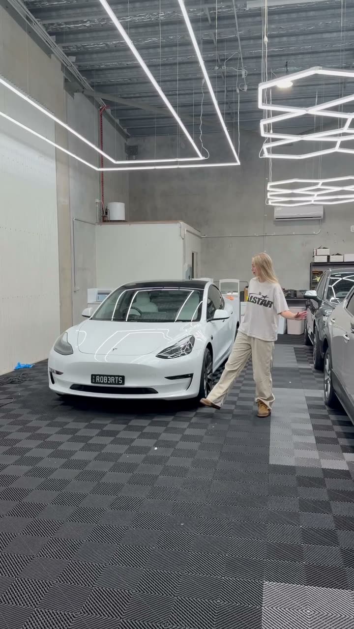 White Tesla Model 3 in the shop